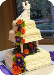 Wedding Cake with Columns and Fresh Flowers 